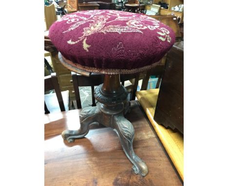 A Victorian pedestal rise and fall piano stool. 