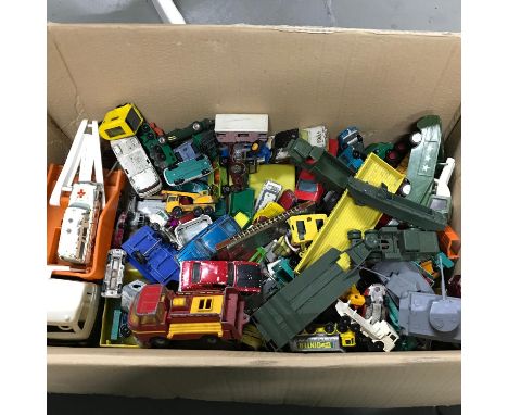 A Box of vintage playworn models which includes corgi. 