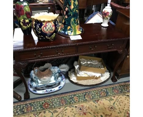 A Reproduction hard wood two drawer console table supported on ball and claw feet. Measures 77x140x57cm 