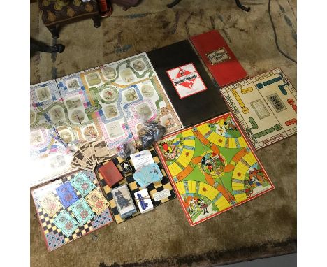 A Lot of vintage board games and card games which includes Monopoly board, Mickey Mouse Board, various counters and cards 