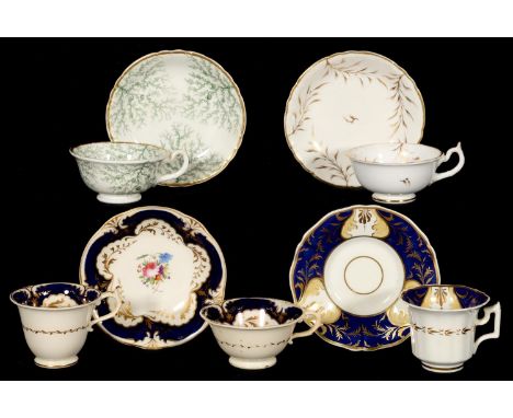 THREE ROCKINGHAM CUPS AND SAUCERS AND A TRIO, C1830-42 various shapes, the trio painted with flowers, saucers 14.5cm diam, pu