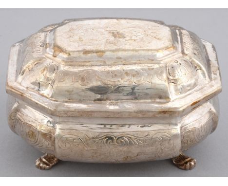 A RUSSIAN SILVER BOMBE SUGAR BOX AND COVER&nbsp; flat chased with scroll work, on four hairy paw feet,&nbsp; 10cm l, Cyrillic