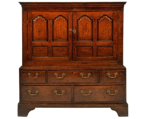 A GEORGE III OAK PRESS CUPBOARD, LATE 18TH C&nbsp; the upper part with cavetto cornice and enclosed by a pair of doors with t