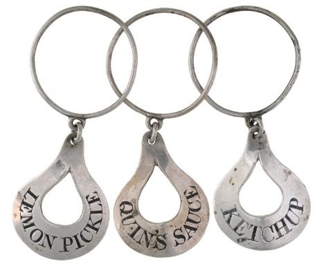 A SET OF THREE UNUSUAL SILVER PEAR SHAPED NECK-RING SAUCE LABELS, C1785,&nbsp; comprising LEMON PICKLE, KETCHUP and QUIN'S SA