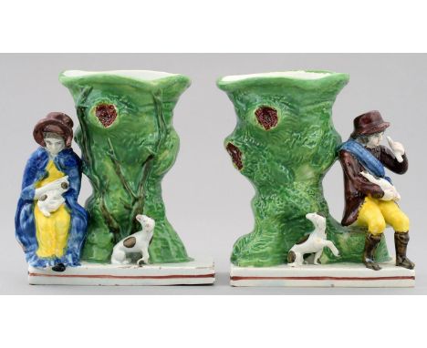 A PAIR OF PEARL GLAZED EARTHENWARE FIGURAL SPILL VASES, C1810-20&nbsp; in the form of a farmer and his wife with their dog se