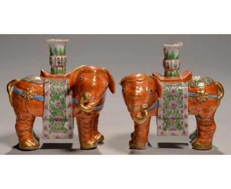 A PAIR OF CHINESE EXPORT PORCELAIN FAMILLE ROSE ELEPHANT INCENSE STANDS, EARLY 19TH C  15.5cm h One nozzle chipped, foot of n