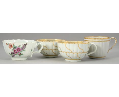 A WORCESTER FLUTED POLYCHROME TEA CUP AND THREE WORCESTER WHITE AND GILT TEA AND&nbsp; COFFEE CUPS, C1770-80&nbsp;various siz