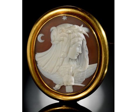 A FINE VICTORIAN CAMEO BROOCH the oval shell carved with the personification of night and emblems of an owl and poppy, set in