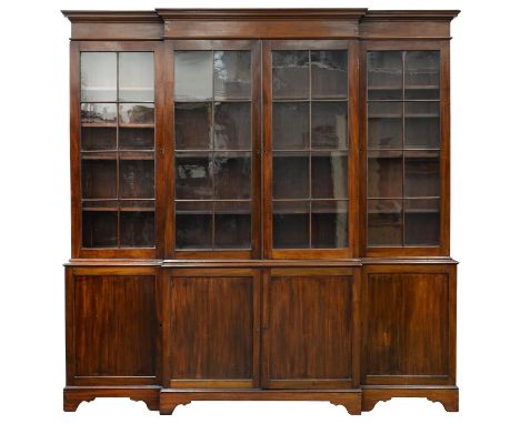 AN EDWARDIAN MAHOGANY BREAKFRONT LIBRARY BOOKCASE, EARLY 20TH C&nbsp; with stepped cornice and fitted with adjustable shelves