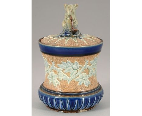 ATTRIBUTED TO GEORGE TINWORTH.&nbsp; A DOULTON WARE TOBACCO JAR AND COVER, 1900&nbsp;of spool shape, the cover set with a mou