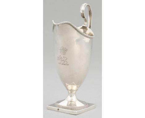 A GEORGE III HELMET SHAPED SILVER CREAM JUG with beaded rims, crested, 16.5cm h, by Robert Hennell, London 1784, 5ozs 4dwts L