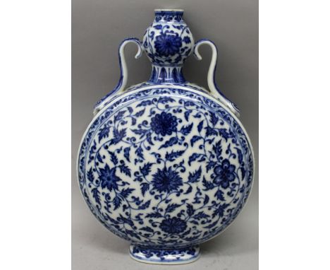 A CHINESE MING STYLE BLUE & WHITE PORCELAIN MOON FLASK, the sides of each domed surface decorated with a formal design of scr