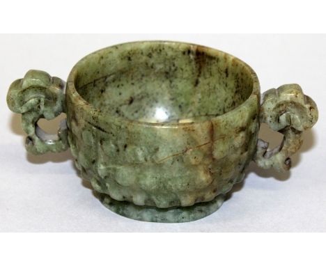 A GOOD 17TH CENTURY CHINESE LATE MING JADE LIBATION CUP, of archaic form with lingzhi handles and raised stud decoration, the