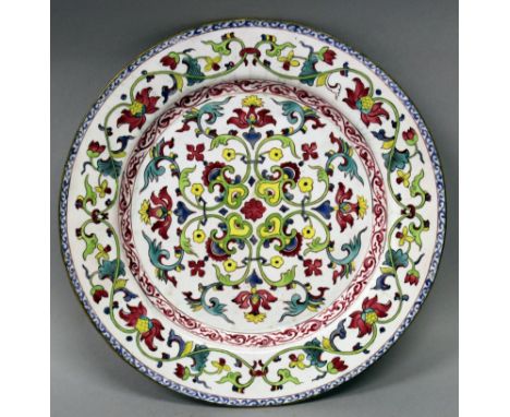 AN UNUSUAL 18TH CENTURY CHINESE QIANLONG PERIOD CANTON ENAMEL DISH, decorated with formal foliate designs and scroll borders,