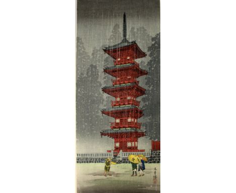 A GOOD QUALITY JAPANESE WOODBLOCK PRINT OF A TEMPLE IN RAIN, unframed, 14.9in x 6.6in, circa 1920/30.