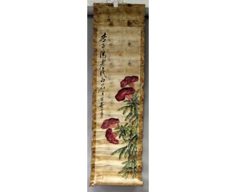 A CHINESE HANGING SCROLL PAINTING ON PAPER, decorated with calligraphy and a flowering shrub, the picture itself approx. 52in