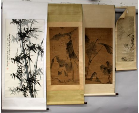 A 19TH CENTURY CHINESE HANGING SCROLL PAINTING ON PAPER, within a patterned silk surround, depicting a bird perched on a bamb