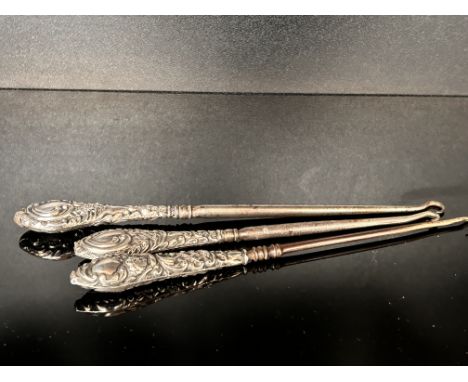 3 Silver handle button hooks 