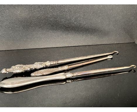 3 Silver handled button hooks 