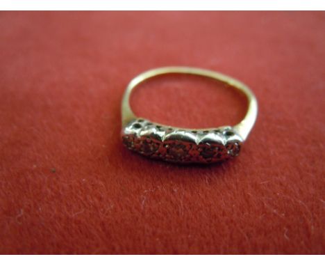 18ct Gold Ring  With platinum mount of four stones (one missing).  (Worn.)