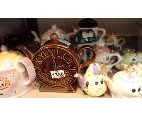 Shelf of collectable novelty tea pots. Not available for in-house P&amp;P, contact Paul O'Hea at Mailboxes on 01925 659133 