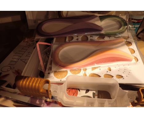 Crafting materials, tray of paper quilling equipment, with unopened paper strips, tools and unused quilling frames and books.