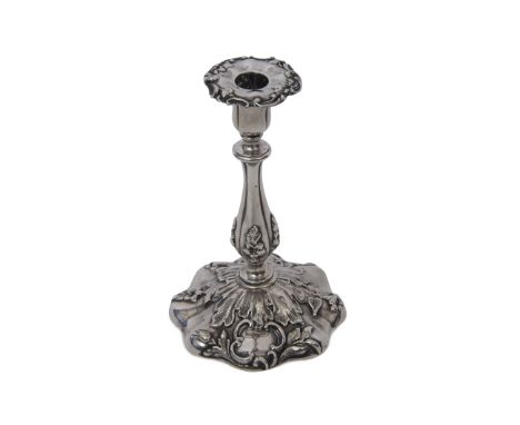 George IV taper stick, the base of shaped circular form with embossed foliate decoration, having floral and leaf embossed bal