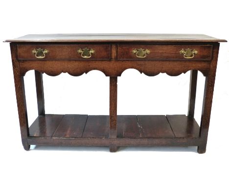 18th century oak small dresser base, plain plank top over two frieze drawers and raised on plain supports with an open shelf 