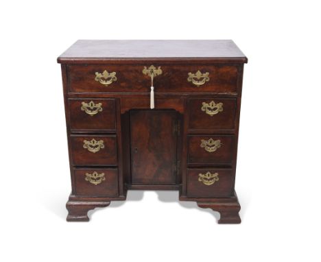 Mahogany small desk, full width frieze drawer over kneehole with cupboard and two integral pedestals, each fitted with three 