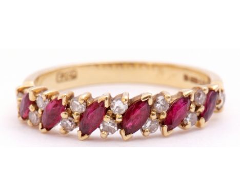 An 18ct gold, ruby and diamond ring, alternate set with angled lozenge shaped rubies and pairs of small single cut diamonds, 