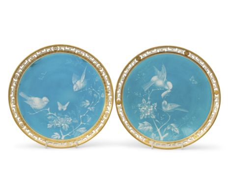 Pair of 19th century Minton plates decorated with birds and butterflies in white enamel on turquoise ground in pate sur pate 