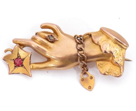 Victorian 9ct gold, ruby and diamond brooch, a design with an outstretched hand holding a flower set with a small ruby, one f
