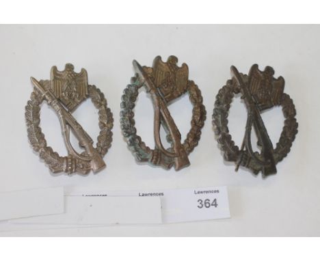 THREE ARMY ASSAULT BADGES. Three German Army Assault Badges, all with straight vertical pin reverses. 1. Marked GWL. 2. Marke