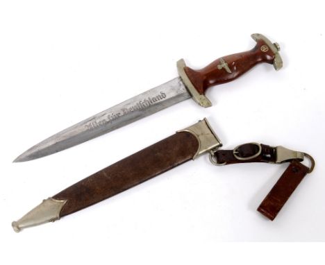 AN S A DAGGER. An SA Dagger with UJN stamped on the crossguard, complete with painted scabbard and belt loop and clip. Makers