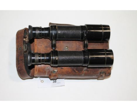 CASED MILITARY BINOCULARS. A pair of cased Dollond of London turn of the century binoculars. Marked in several places with th