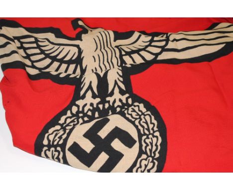 A KRIEGSMARINE BATTLE ENSIGN. A large 11' x 6' German Navy Flag of the Nazi period Kriegsmarine, complete with fixing rope an