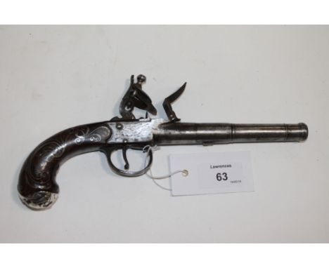 A QUEEN ANNE FLINTLOCK PISTOL. A Ketland & Co Queen Anne silver inlay pistol, with devils mask buttplate. Turn off 3.3/4" rou