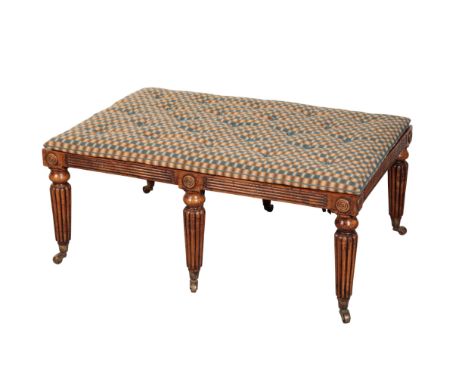 A REGENCY STYLE OAK BENCH 20th Century, by Christopher Howe, the cane top above fluted sides decorated with carved roundels, 