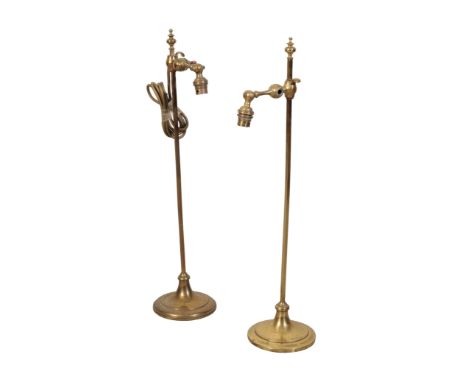 A PAIR OF ADJUSTABLE BRASS TABLE LAMPS BY FARADAY &amp; SONS, the adjustable light fitting attached to the square columnar sh