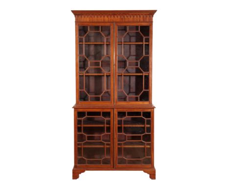 A 19TH CENTURY GLAZED BOOKCASE in the George III style, the moulded cornice above astragal glazed doors containing two shelve