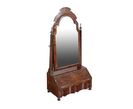 A QUEEN ANNE WALNUT DRESSING MIRROR First quarter 18th century and later, the shaped rectangular swing plate flanked by mould