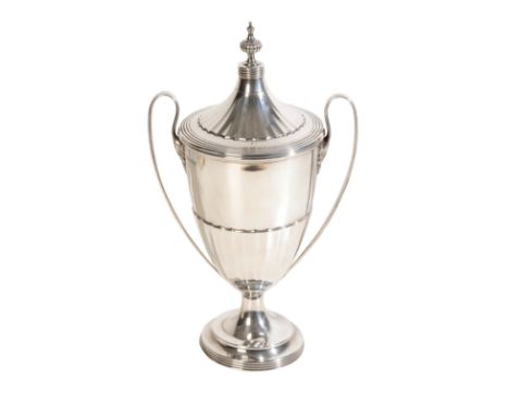 A 20TH CENUTRY SILVER TROPHY by Walker and Hall, Sheffield, 1924, with a formed finial, fluted and reeeded lid, half fluted b