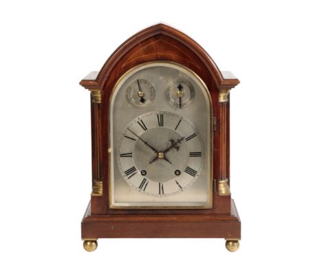 AN EDWARDIAN MAHOGANY BRACKET CLOCK the silvered dial with Roman numerals, and two subsidiary dials, "slow/Fast" and "Chime /