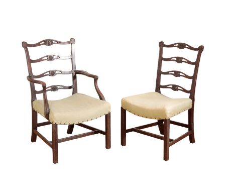 A SET OF FIVE GEORGE III MAHOGANY DINING CHAIRS each rectangular 'ladder' back with four pierced cross splats, each centred b