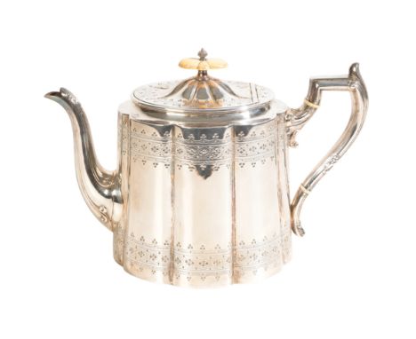 A 20TH CENTURY SILVER TEA POT by James Dixon &amp; Sons, Sheffield, 1965, of oval lobed form, with bright cut decoration, bon