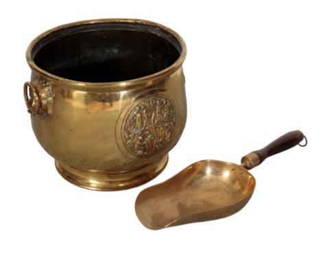 A 17TH CENTURY STYLE BRASS COAL BUCKET with lion mask ring handles and decorated in relief with people embracing together wit