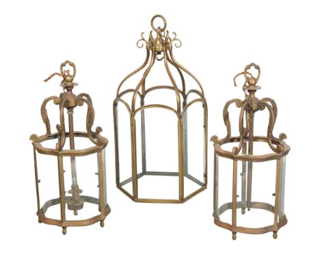 A PAIR OF BRASS HALL LANTERNS of pentagonal section, with scrolling mounts, one missing its two branch lighting, 43cm high, t