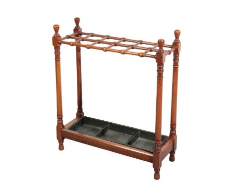A MAHOGANY STICK STAND 19th century, with twelve divisions and turned knop finials above a metal drip tray, Width 61cm; Heigh