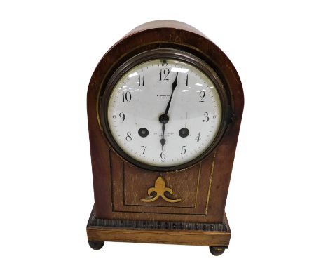 A late 19thC French mahogany cased mantel clock, with brass inlay, for E White, 32 Haymarket, London, circular enamel dial be