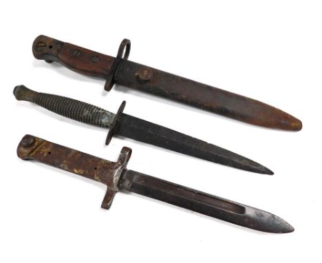 A Fairbairn-Sykes commando knife, a World War I bayonet, bearing number 90803, and a WSC bayonet and scabbard. (3) 